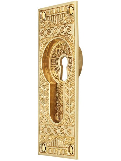 Windsor Pattern Pocket Door Pull with Keyhole in Polished Brass.